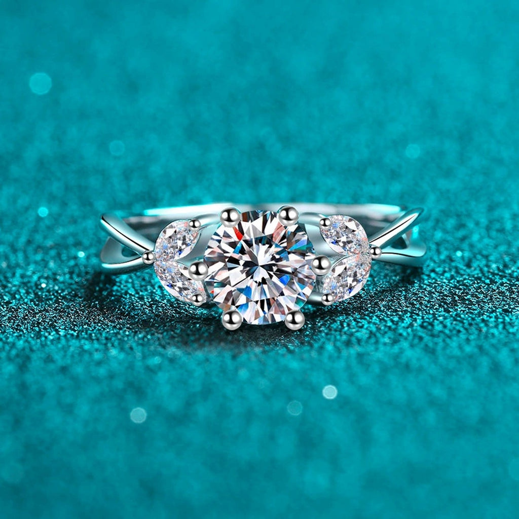 Round Moissanite Side Stone Engagement Ring with CZ product view showing moissanite setting and metal finish