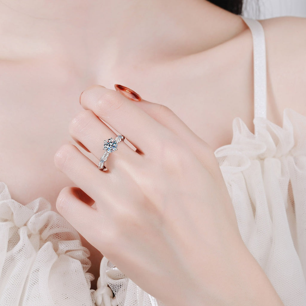 Round Moissanite Side Stone Ring with CZ worn on hand to show scale, band width, and ring profile