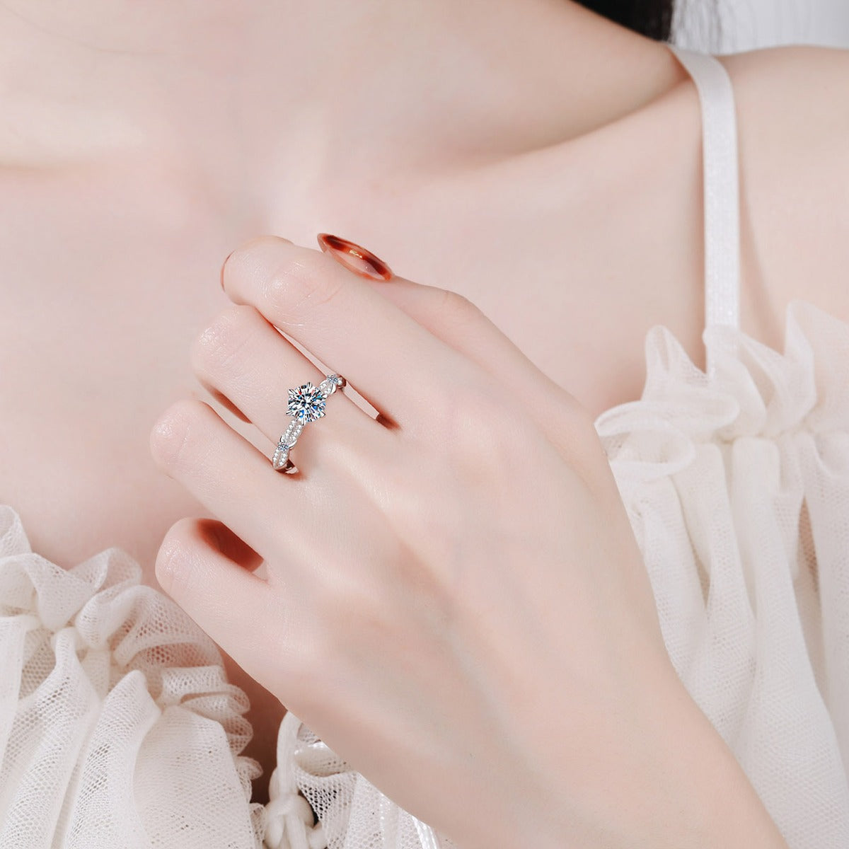 Round Moissanite Side Stone Ring with CZ worn on hand to show scale, band width, and ring profile