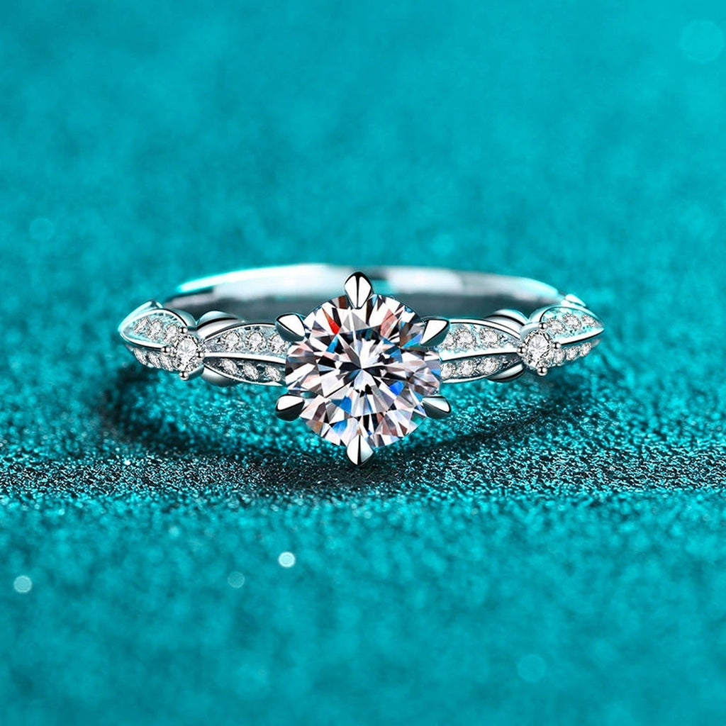 Round Moissanite Side Stone Ring with CZ product view showing moissanite setting and metal finish