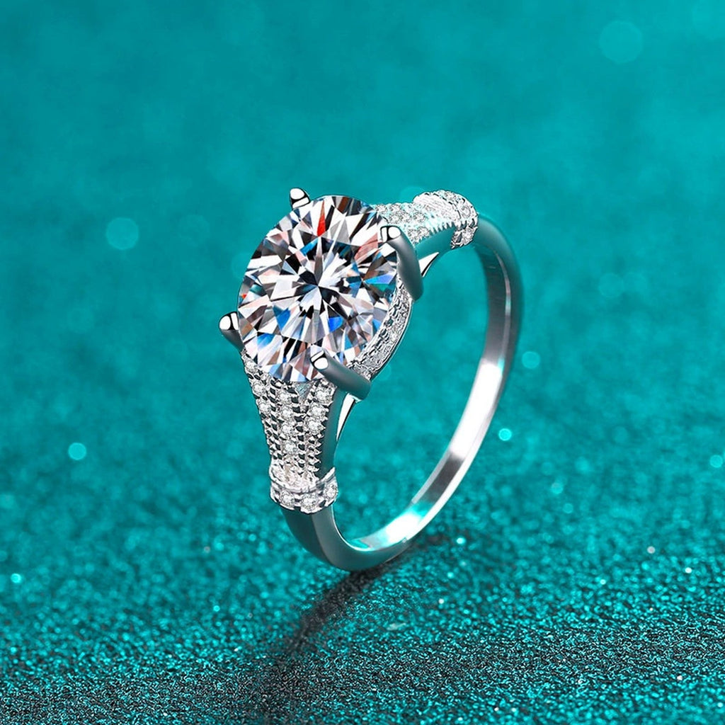 Oval Cut Moissanite Side Stone Engagement Ring with CZ product view showing moissanite setting and metal finish