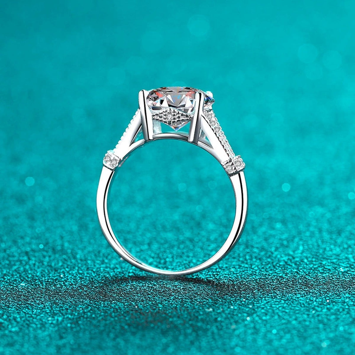 Oval Cut Moissanite Side Stone Engagement Ring with CZ product view showing moissanite setting and metal finish