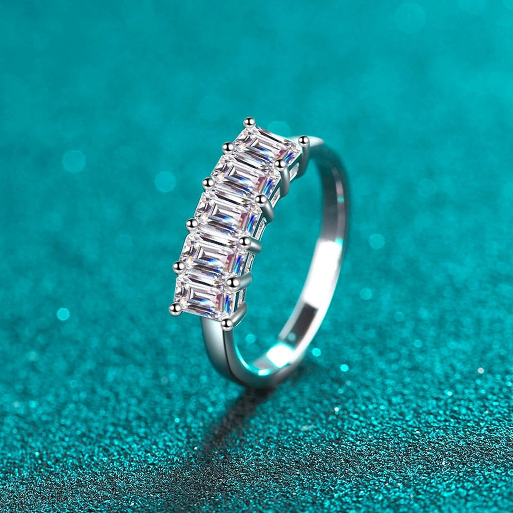 Emerald Cut Moissanite Five Stone Band Ring in Rhodium-Plated S925 Sterling Silver blue display product photo showing the moissanite setting, stone cut, and band profile