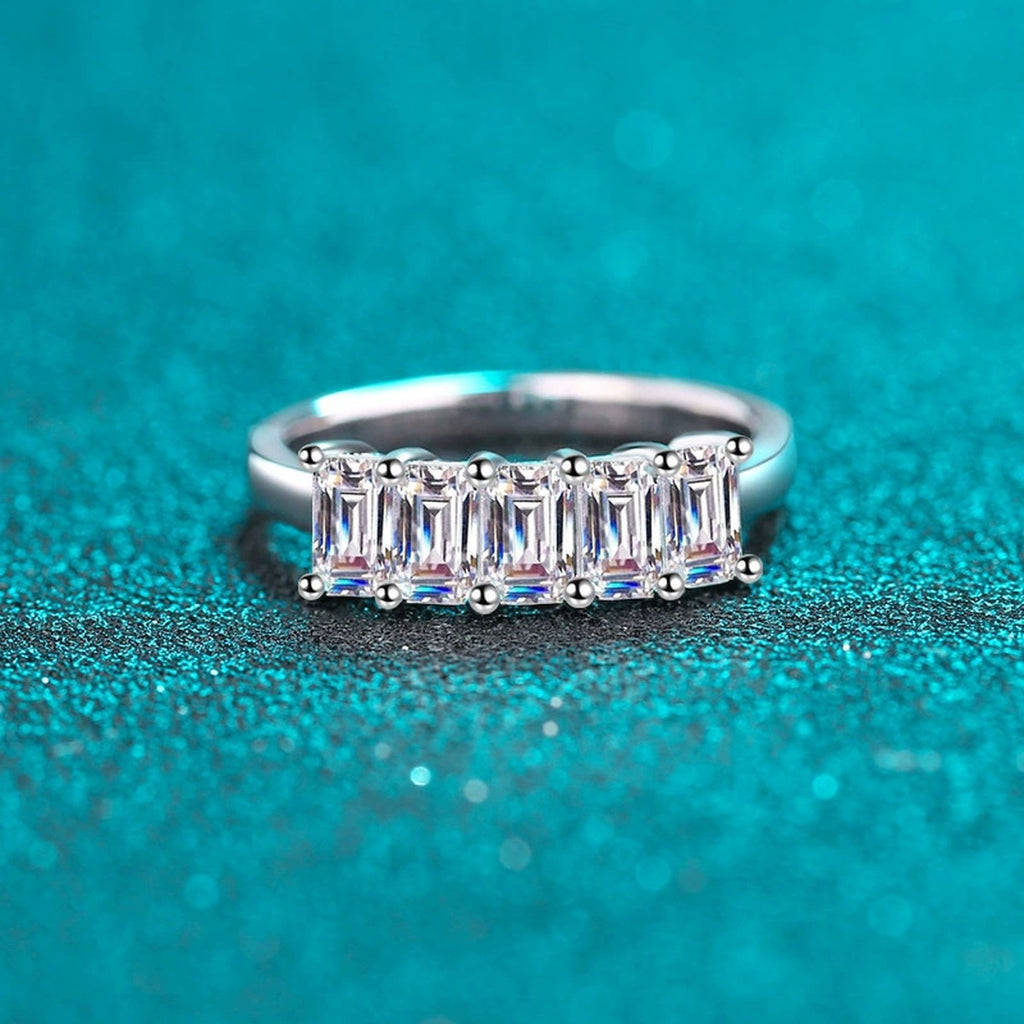 Emerald Cut Moissanite Five Stone Band Ring in Rhodium-Plated S925 Sterling Silver blue display product photo showing the moissanite setting, stone cut, and band profile