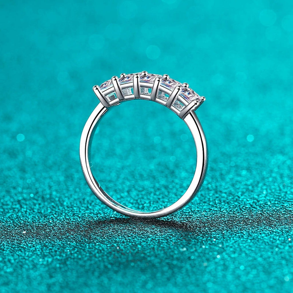 Emerald Cut Moissanite Five Stone Band Ring in Rhodium-Plated S925 Sterling Silver blue display product photo showing the moissanite setting, stone cut, and band profile