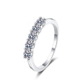 Round Moissanite Eternity Band Ring in rhodium-plated S925 sterling silver on clean white background