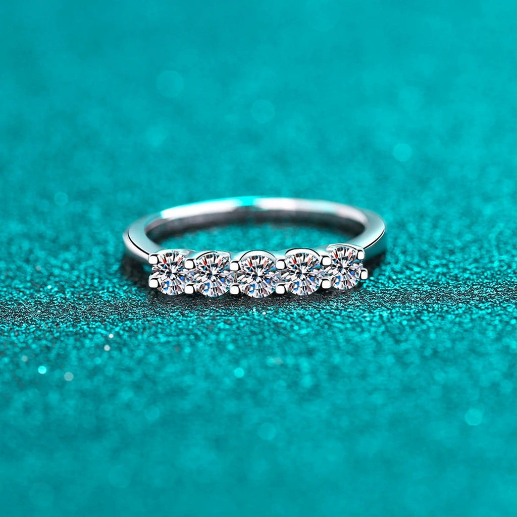 Round Moissanite Eternity Band Ring product view showing moissanite setting and rhodium finish