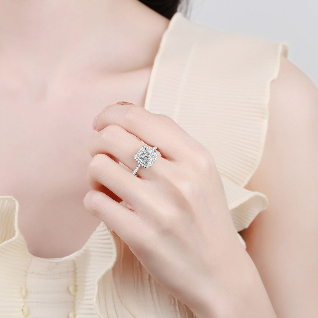 Princess Cut Moissanite Halo Engagement Ring with CZ in Rhodium-Plated S925 Sterling Silver worn on hand, showing scale, finger coverage, and rhodium-plated finish