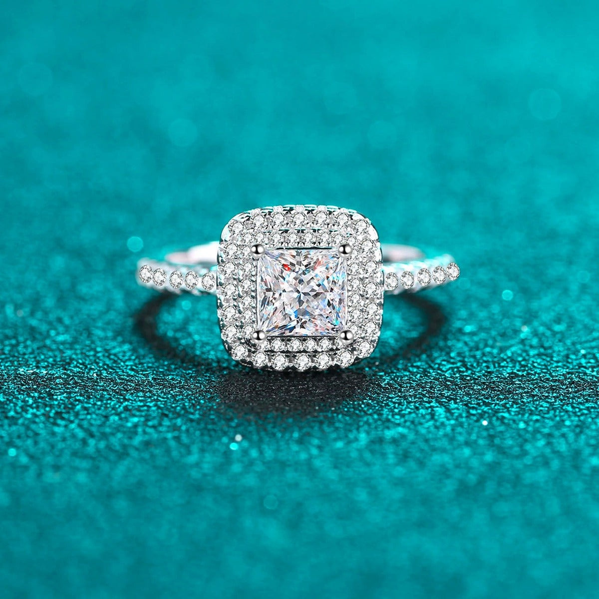 Princess Cut Moissanite Halo Engagement Ring with CZ in Rhodium-Plated S925 Sterling Silver blue display product photo showing the moissanite setting, stone cut, and band profile