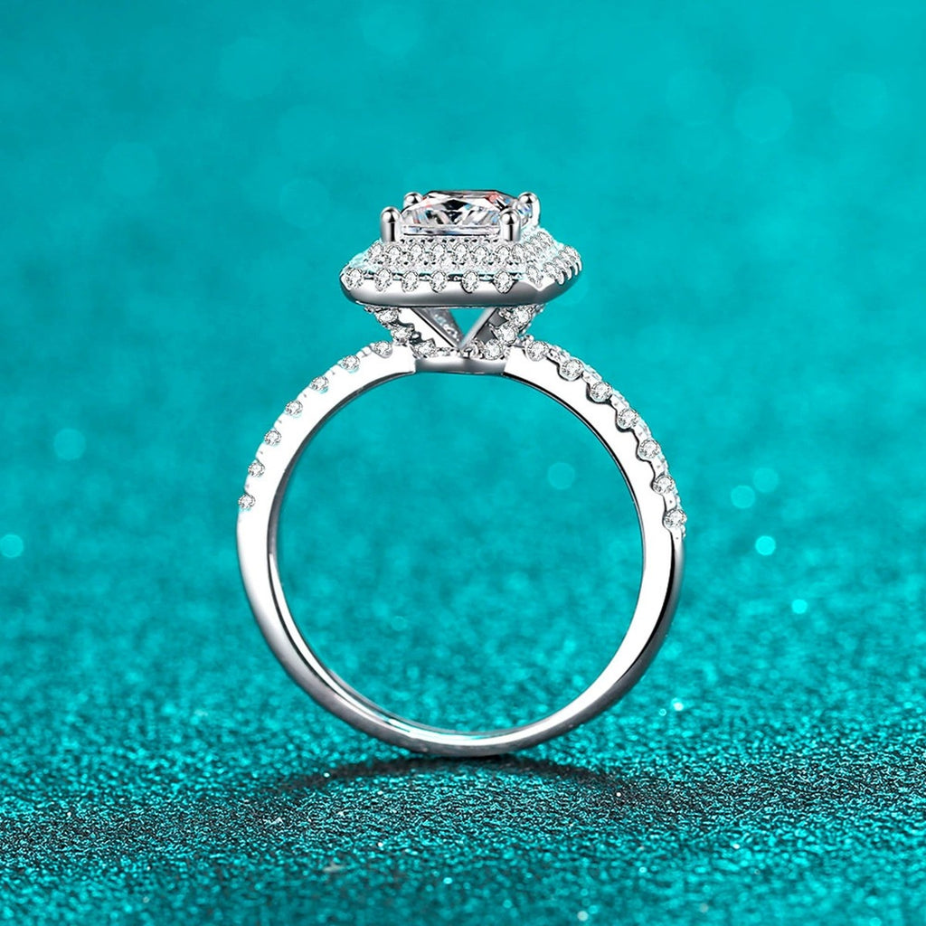 Princess Cut Moissanite Halo Engagement Ring with CZ in Rhodium-Plated S925 Sterling Silver blue display product photo showing the moissanite setting, stone cut, and band profile