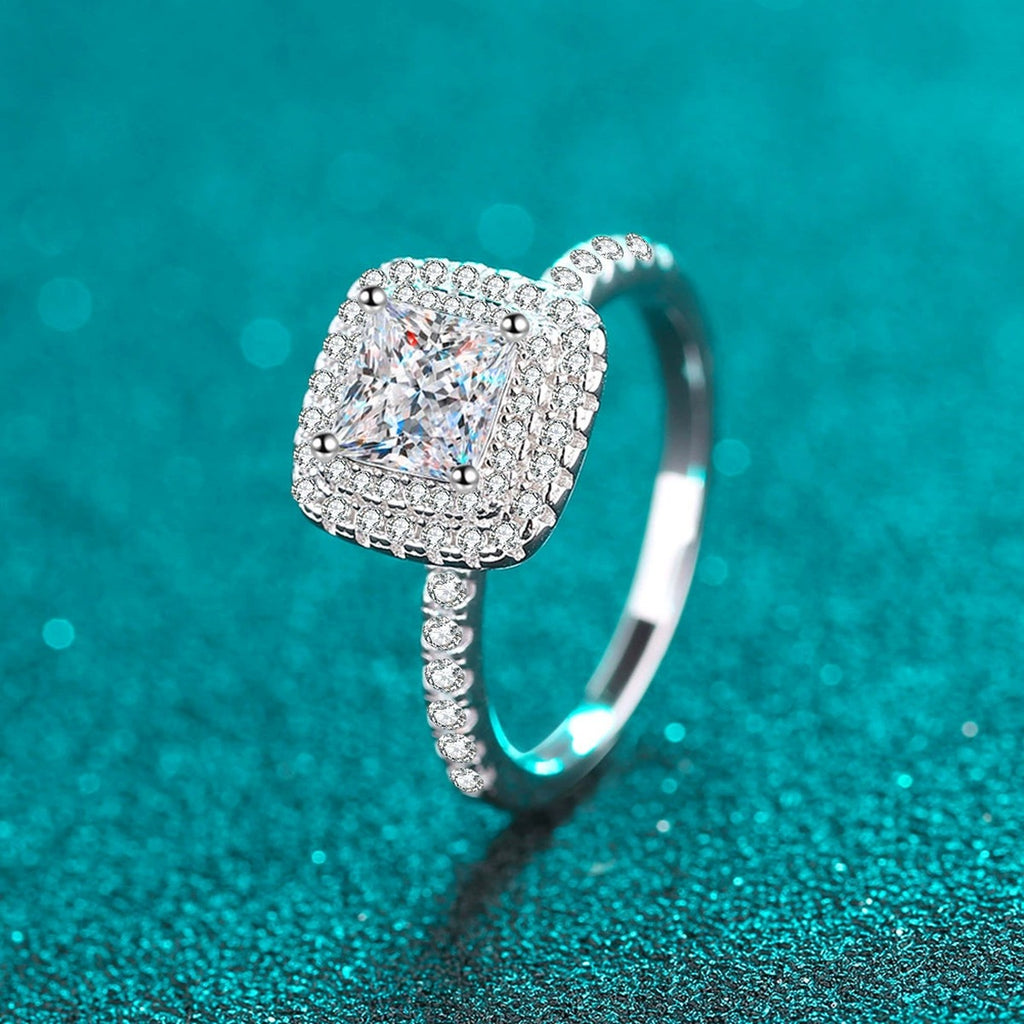 Princess Cut Moissanite Halo Engagement Ring with CZ in Rhodium-Plated S925 Sterling Silver blue display product photo showing the moissanite setting, stone cut, and band profile