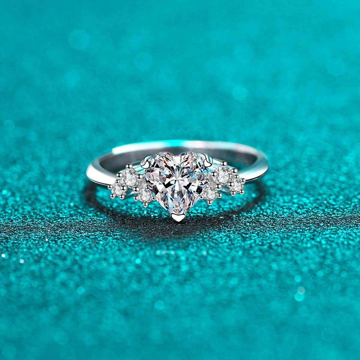 Heart Cut Moissanite Side Stone Engagement Ring with CZ in Rhodium-Plated S925 Sterling Silver blue display product photo showing the moissanite setting, stone cut, and band profile