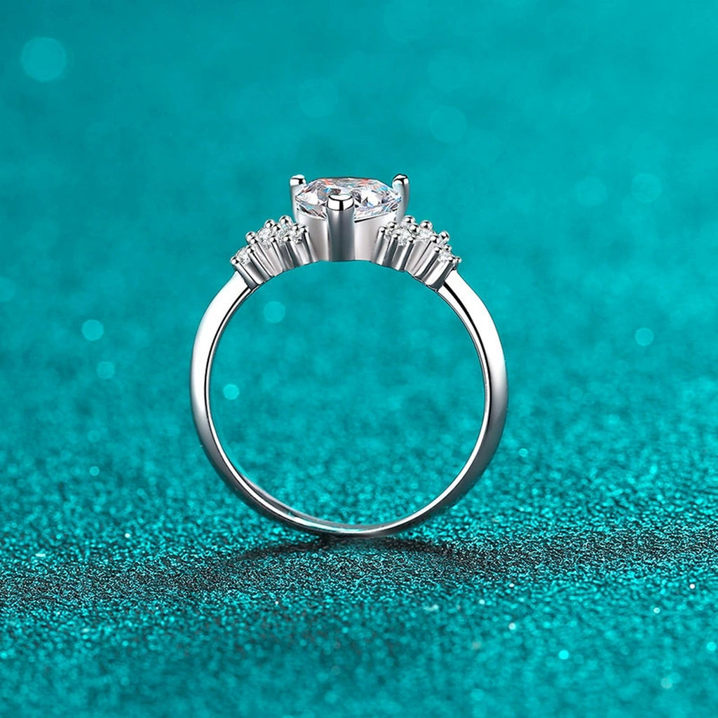 Heart Cut Moissanite Side Stone Engagement Ring with CZ in Rhodium-Plated S925 Sterling Silver blue display product photo showing the moissanite setting, stone cut, and band profile
