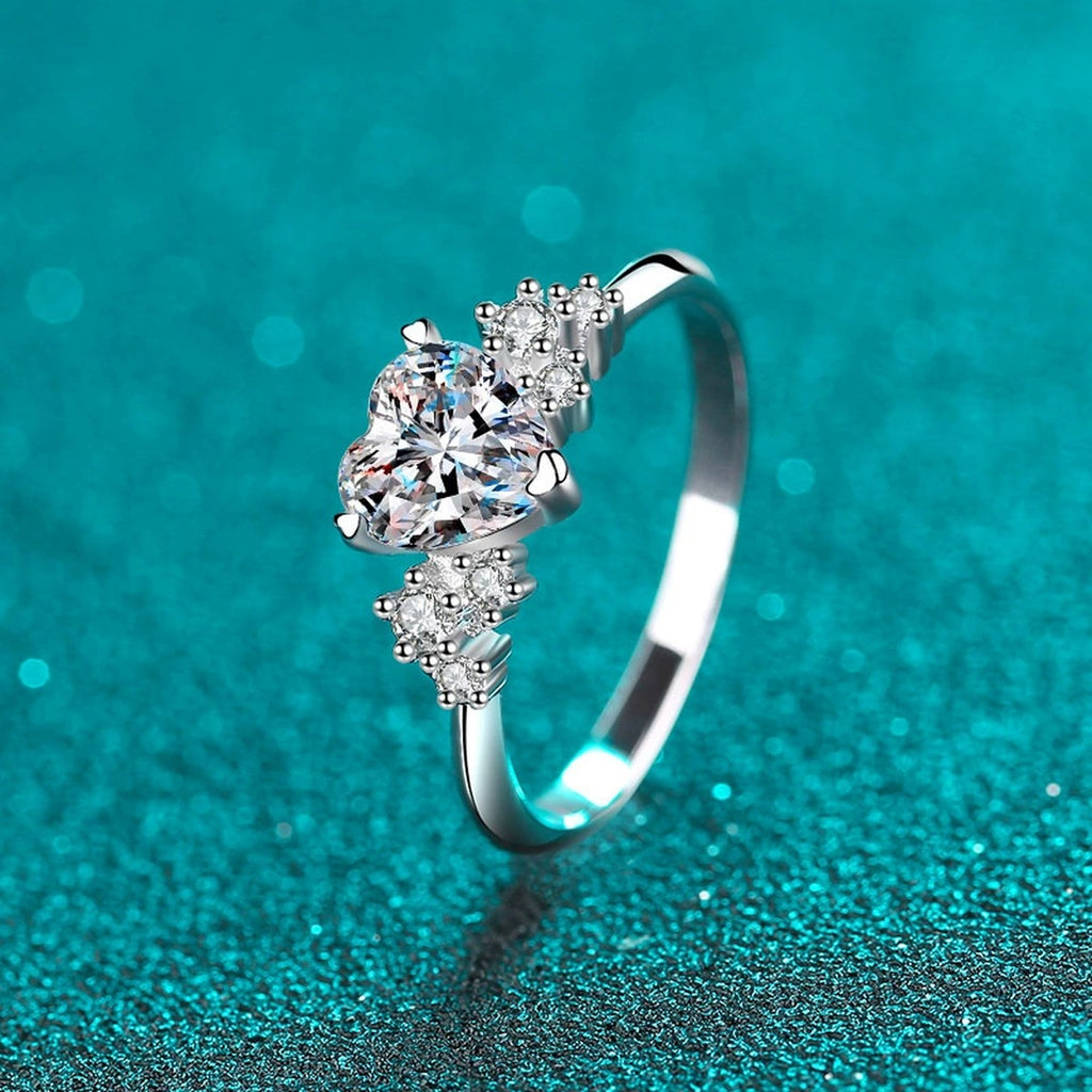 Heart Cut Moissanite Side Stone Engagement Ring with CZ in Rhodium-Plated S925 Sterling Silver blue display product photo showing the moissanite setting, stone cut, and band profile