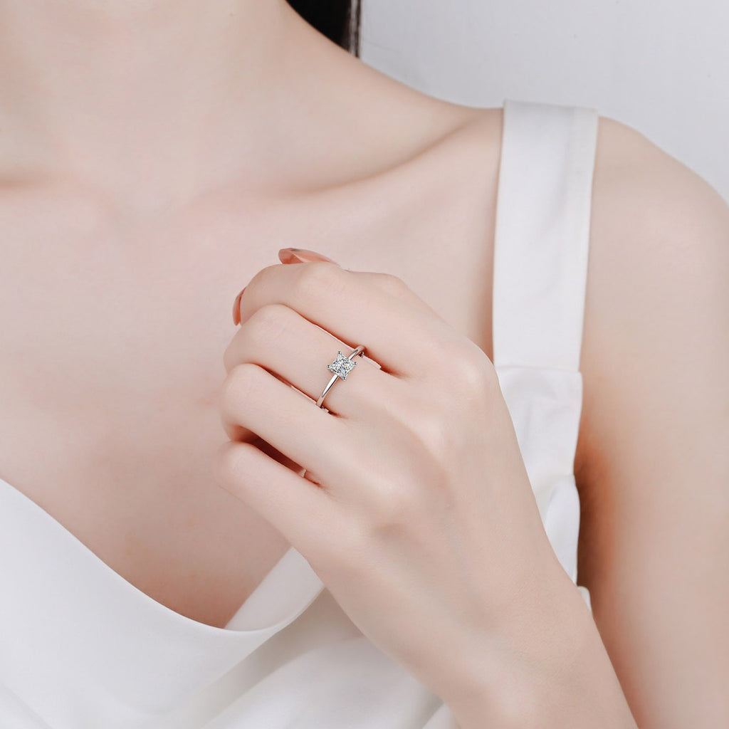 Princess Cut Moissanite Solitaire Ring in Rhodium-Plated S925 Sterling Silver worn on hand, showing scale, finger coverage, and rhodium-plated finish