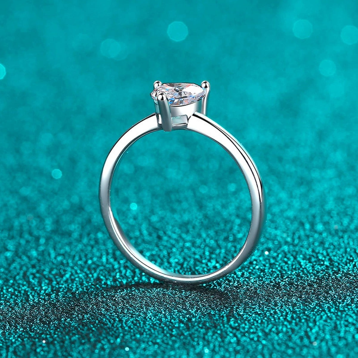 Heart Cut Moissanite Promise Ring in Rhodium-Plated S925 Sterling Silver blue display product photo showing the moissanite setting, stone cut, and band profile