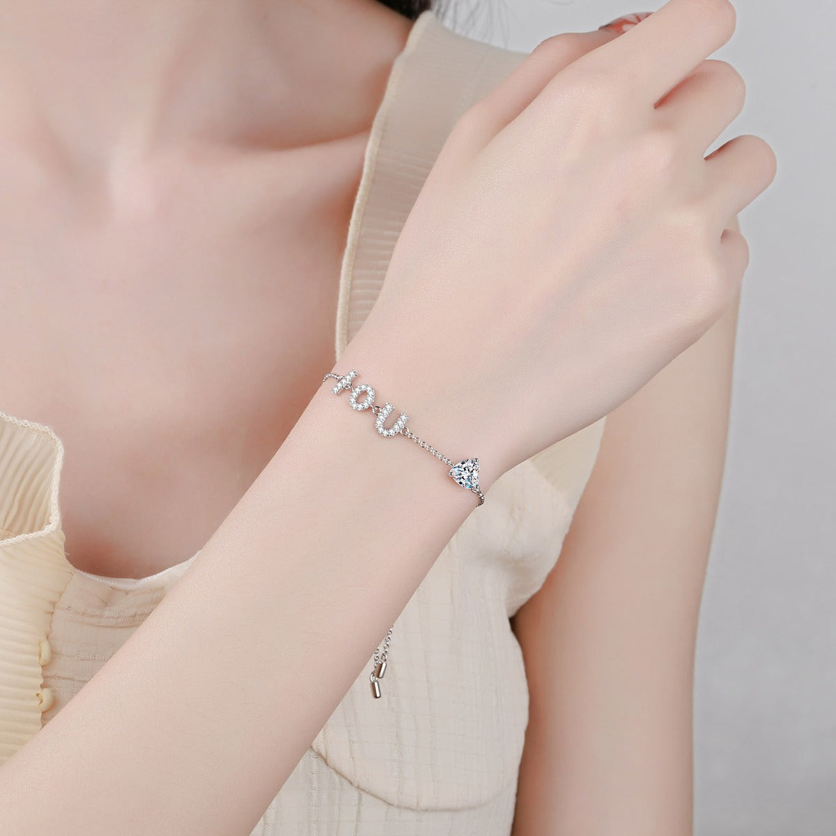LOVE Heart Moissanite Adjustable Bracelet with CZ in Rhodium-Plated S925 sterling silver worn on wrist model view showing scale and adjustable fit
