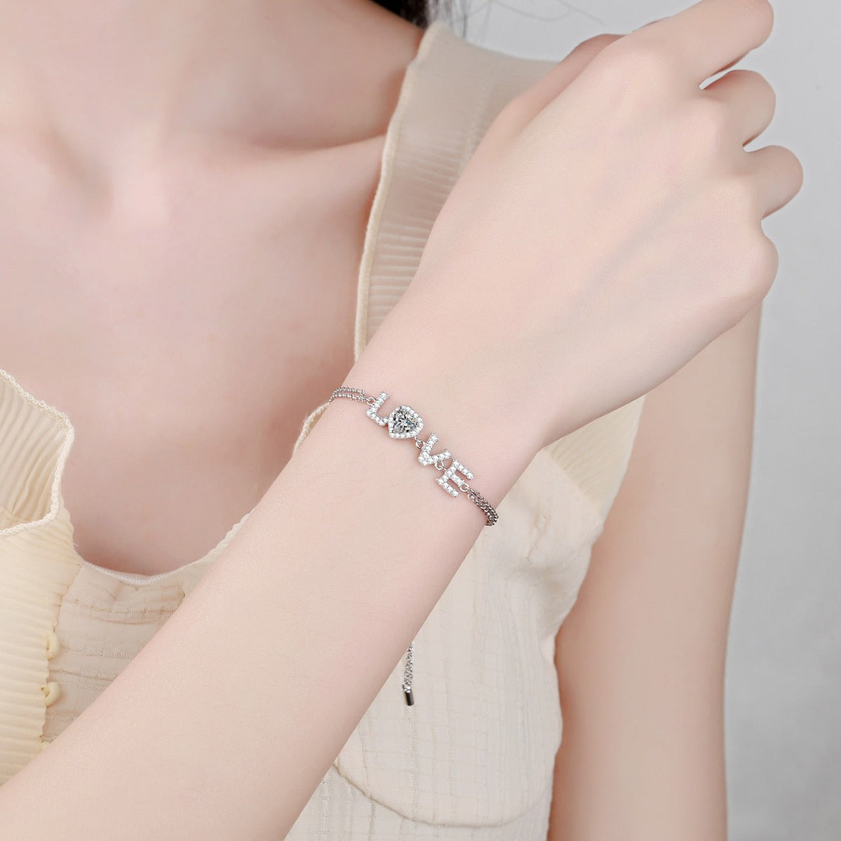LOVE Heart Moissanite Adjustable Bracelet with CZ in Rhodium-Plated S925 sterling silver worn on wrist model view showing scale and adjustable fit