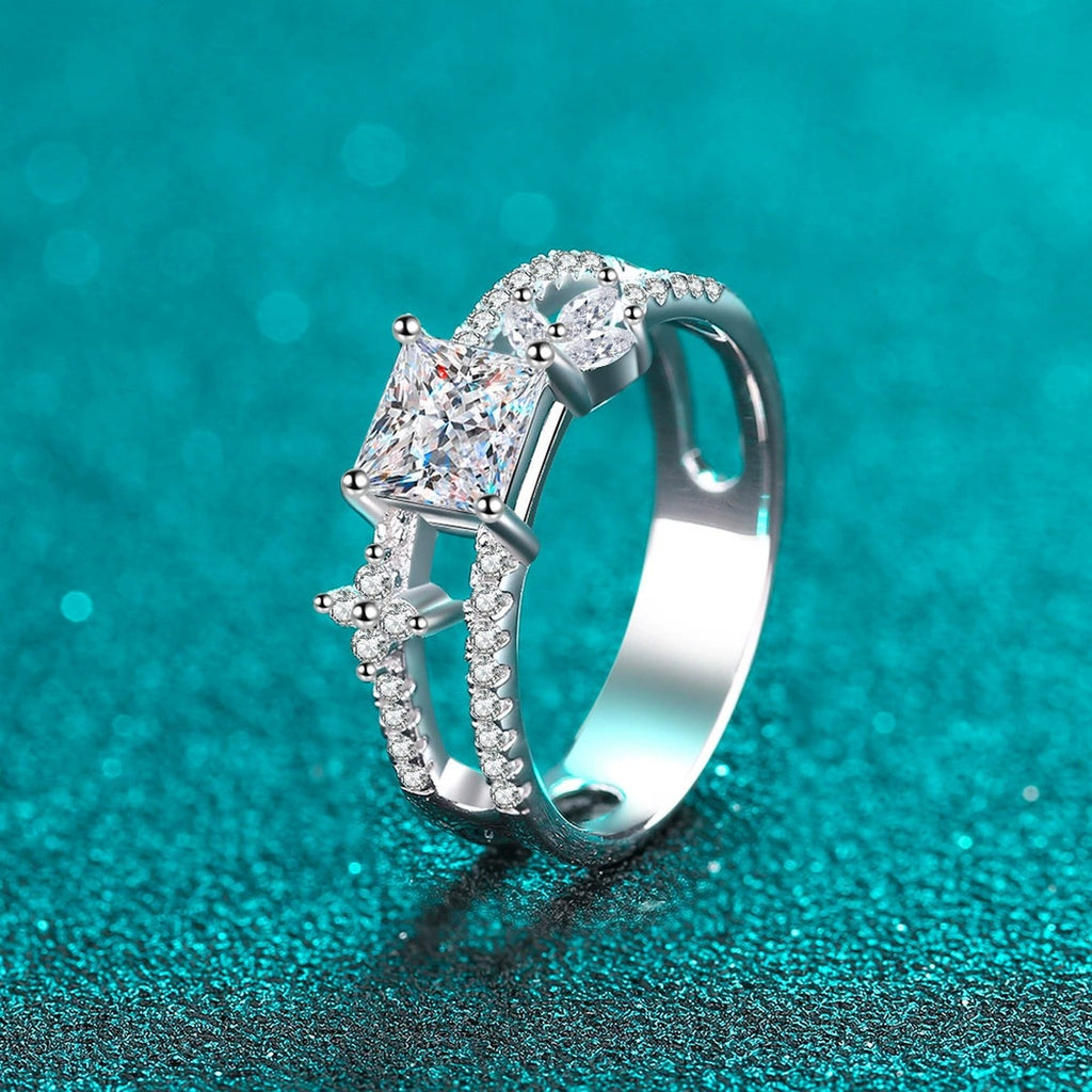 Princess Cut Moissanite Side Stone Engagement Ring with CZ in Rhodium-Plated S925 Sterling Silver blue display product photo showing the moissanite setting, stone cut, and band profile