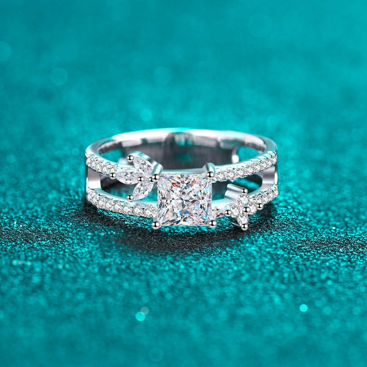 Princess Cut Moissanite Side Stone Engagement Ring with CZ in Rhodium-Plated S925 Sterling Silver blue display product photo showing the moissanite setting, stone cut, and band profile