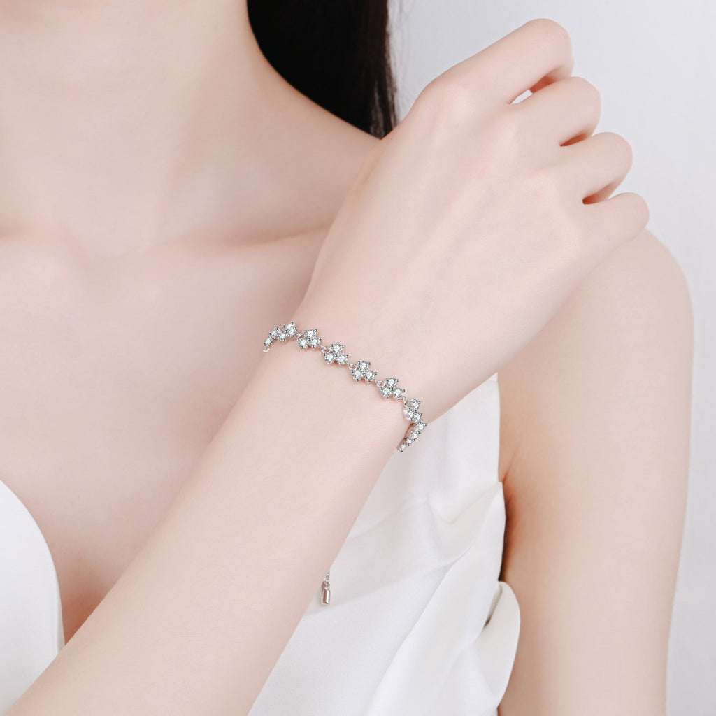 Floral Tennis Moissanite Adjustable Bracelet in Rhodium-Plated S925 sterling silver worn on wrist model view showing scale and adjustable fit