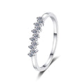 Dainty Round Moissanite Band Ring in rhodium-plated S925 sterling silver on clean white background