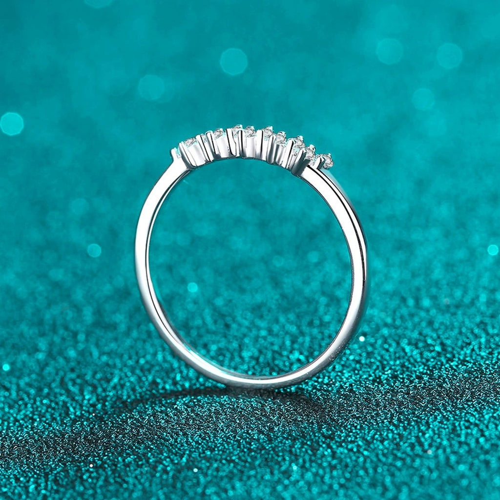 Dainty Round Moissanite Band Ring product view showing moissanite setting and rhodium finish