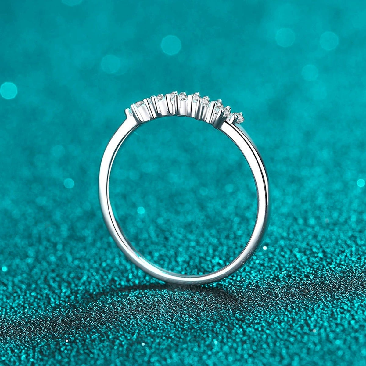 Dainty Round Moissanite Band Ring product view showing moissanite setting and rhodium finish