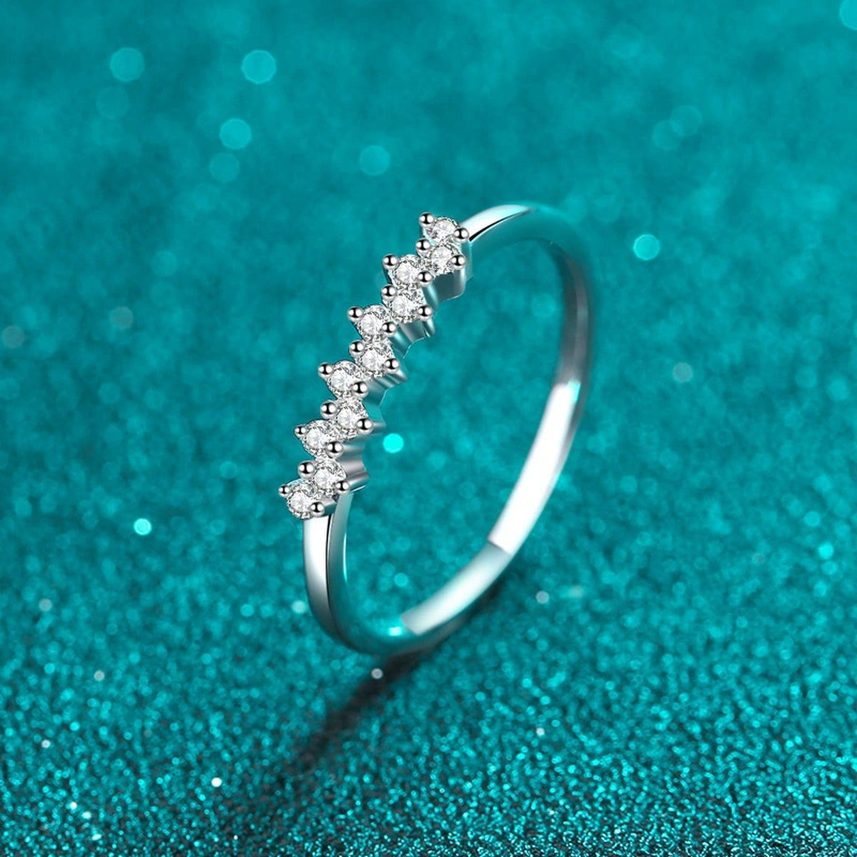 Dainty Round Moissanite Band Ring product view showing moissanite setting and rhodium finish