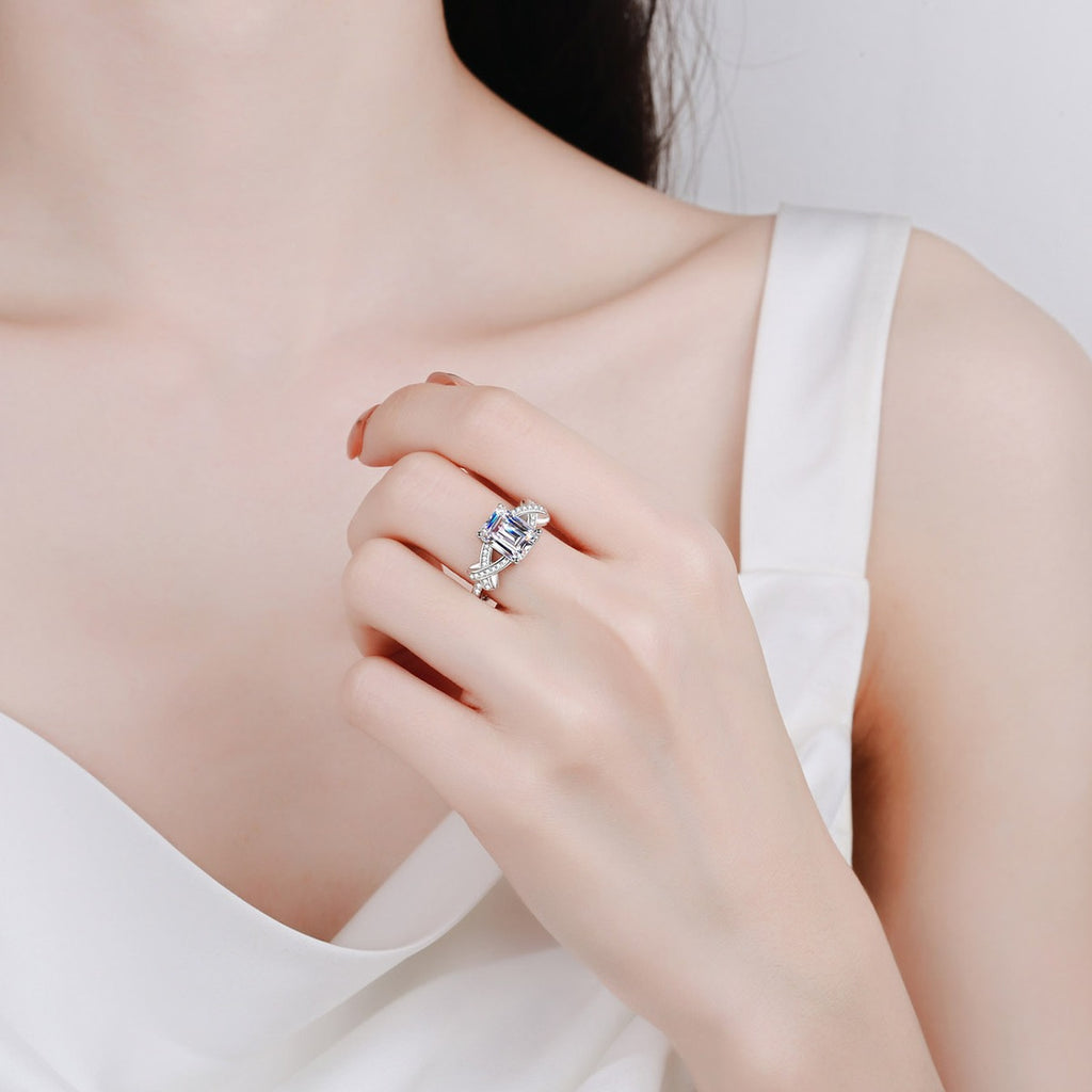 Emerald and Radiant Cut Moissanite Engagement Ring with CZ in Rhodium-Plated S925 Sterling Silver worn on hand, showing scale, finger coverage, and rhodium-plated finish
