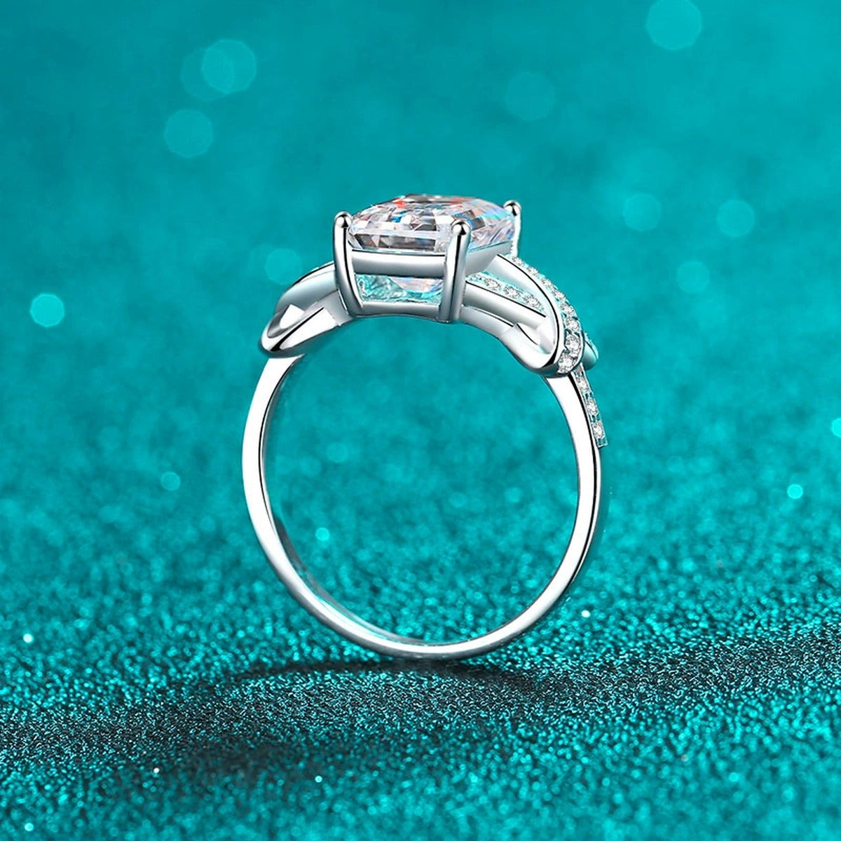 Emerald and Radiant Cut Moissanite Engagement Ring with CZ in Rhodium-Plated S925 Sterling Silver blue display product photo showing the moissanite setting, stone cut, and band profile