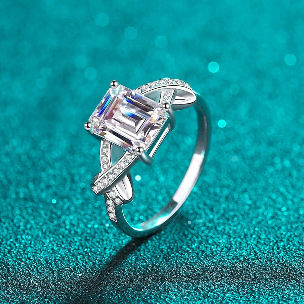 Emerald and Radiant Cut Moissanite Engagement Ring with CZ in Rhodium-Plated S925 Sterling Silver blue display product photo showing the moissanite setting, stone cut, and band profile