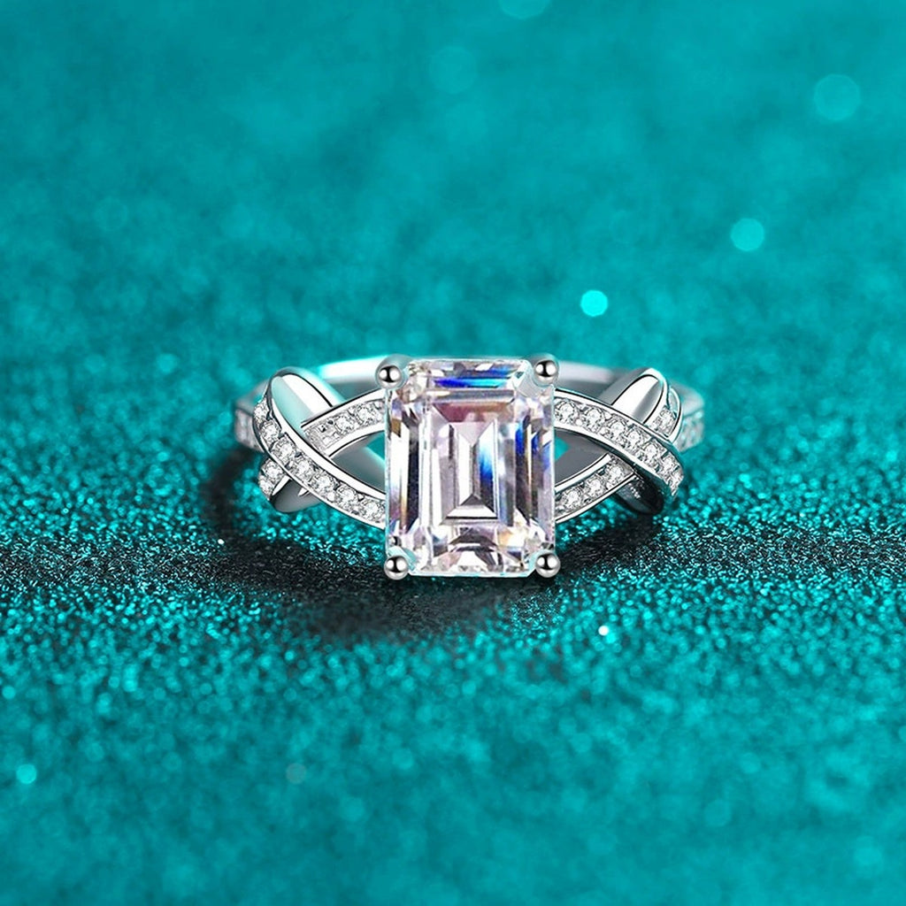 Emerald and Radiant Cut Moissanite Engagement Ring with CZ in Rhodium-Plated S925 Sterling Silver blue display product photo showing the moissanite setting, stone cut, and band profile
