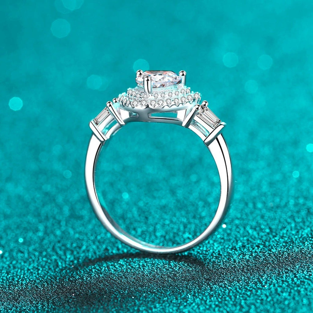 Heart Cut Moissanite Side Stone Engagement Ring with CZ in Rhodium-Plated S925 Sterling Silver blue display product photo showing the moissanite setting, stone cut, and band profile