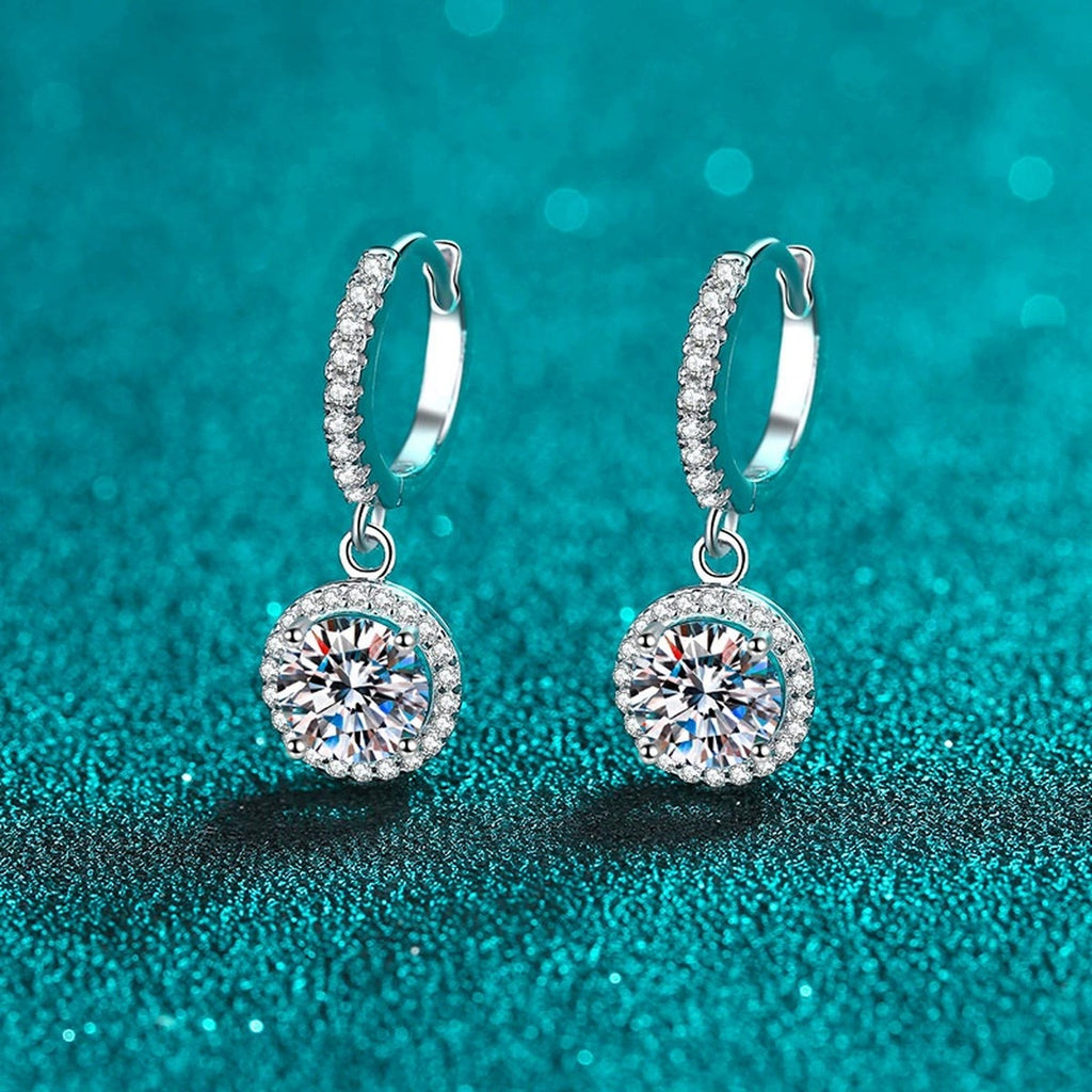Round Halo Moissanite Hoop Dangle Earrings with CZ in Rhodium-Plated S925 sterling silver product scene view showing angled setting detail, moissanite setting, and hoop dangle earrings design