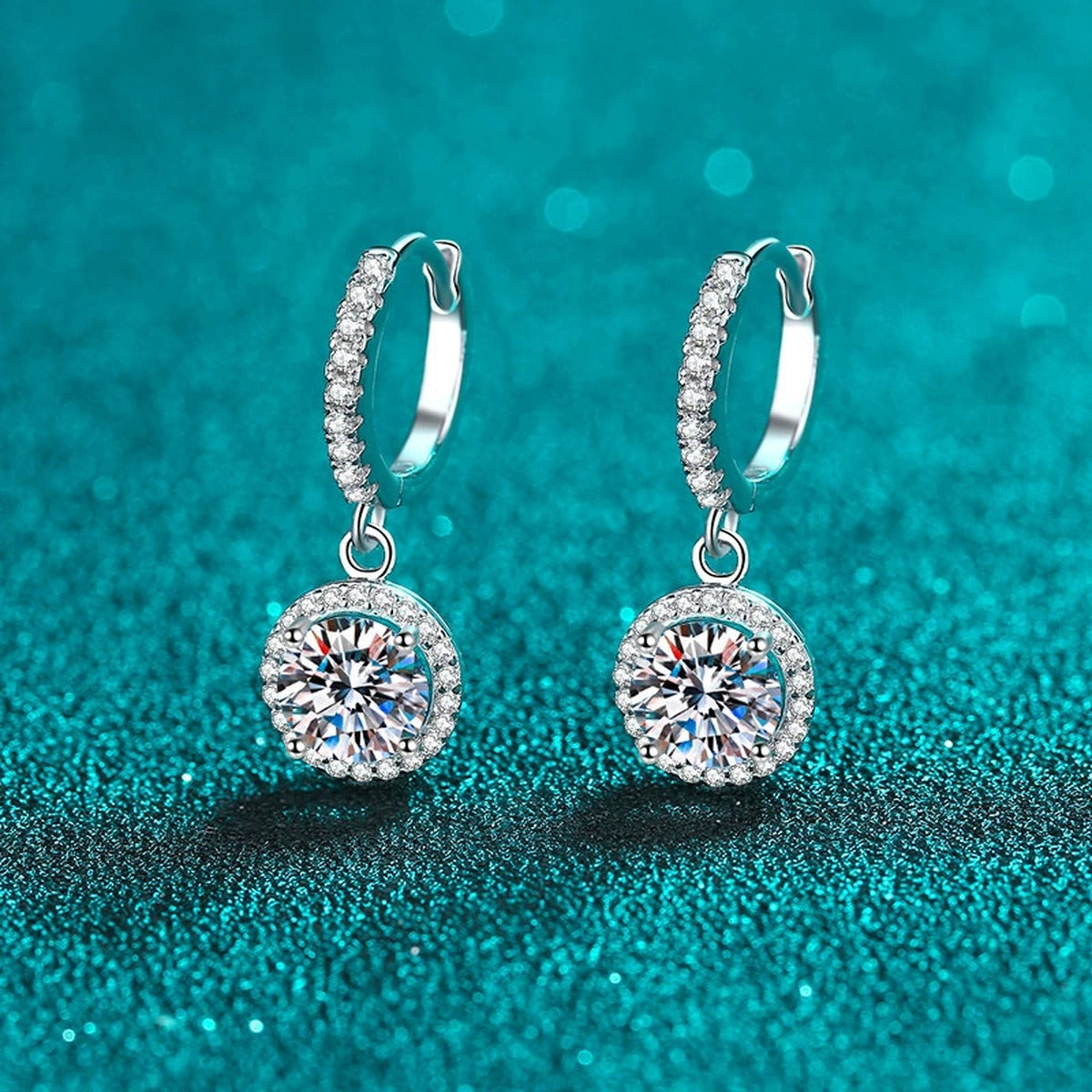 Round Halo Moissanite Hoop Dangle Earrings with CZ in Rhodium-Plated S925 sterling silver product scene view showing angled setting detail, moissanite setting, and hoop dangle earrings design