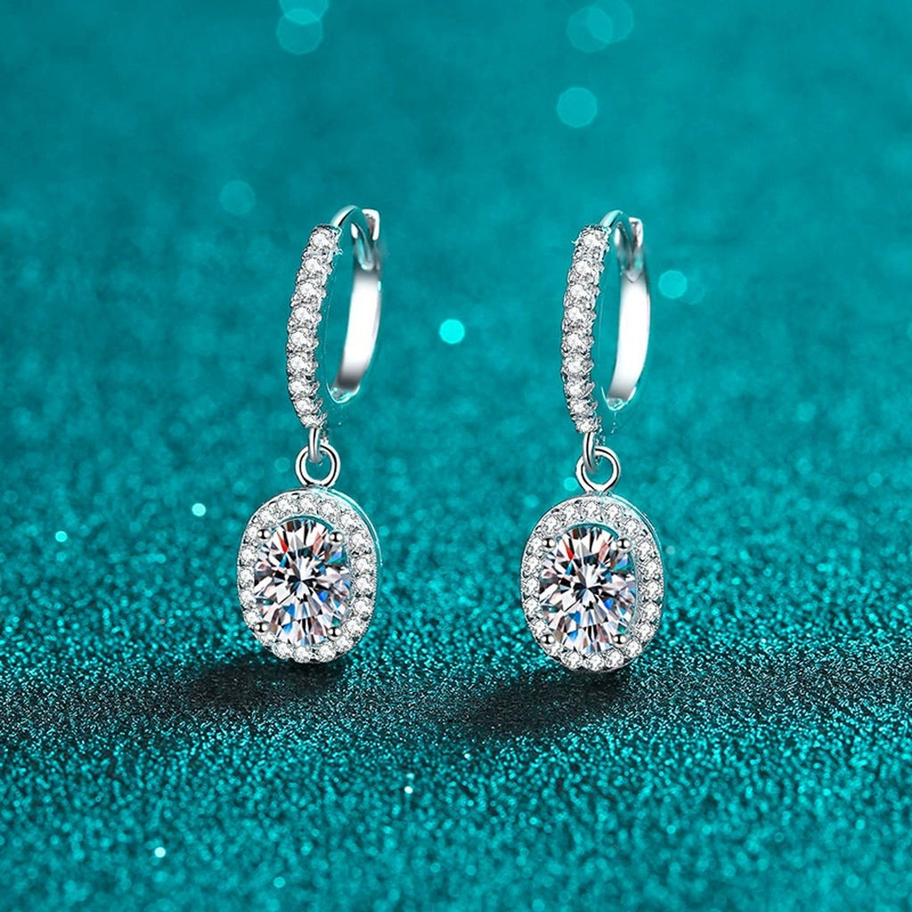 Oval Moissanite Hoop Dangle Earrings with CZ in Rhodium-Plated S925 sterling silver product scene view showing front sparkle, moissanite setting, and hoop dangle earrings design