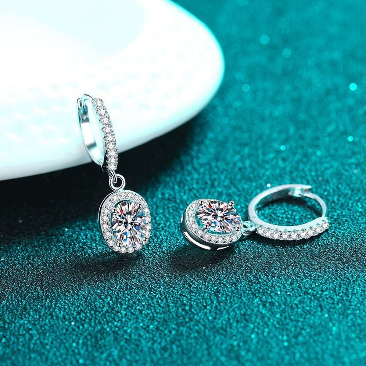 Oval Moissanite Hoop Dangle Earrings with CZ in Rhodium-Plated S925 sterling silver product scene view showing side profile, moissanite setting, and hoop dangle earrings design