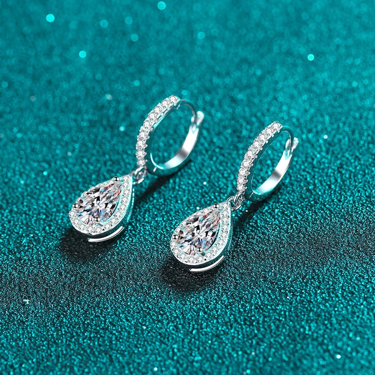 Pear Moissanite Hoop Dangle Earrings with CZ in Rhodium-Plated S925 sterling silver product scene view showing angled setting detail, moissanite setting, and hoop dangle earrings design