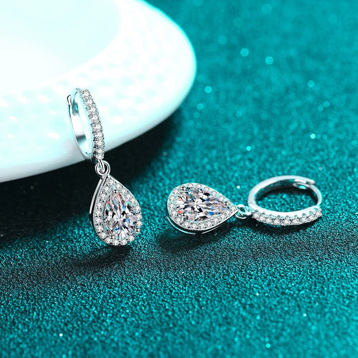 Pear Moissanite Hoop Dangle Earrings with CZ in Rhodium-Plated S925 sterling silver product scene view showing side profile, moissanite setting, and hoop dangle earrings design