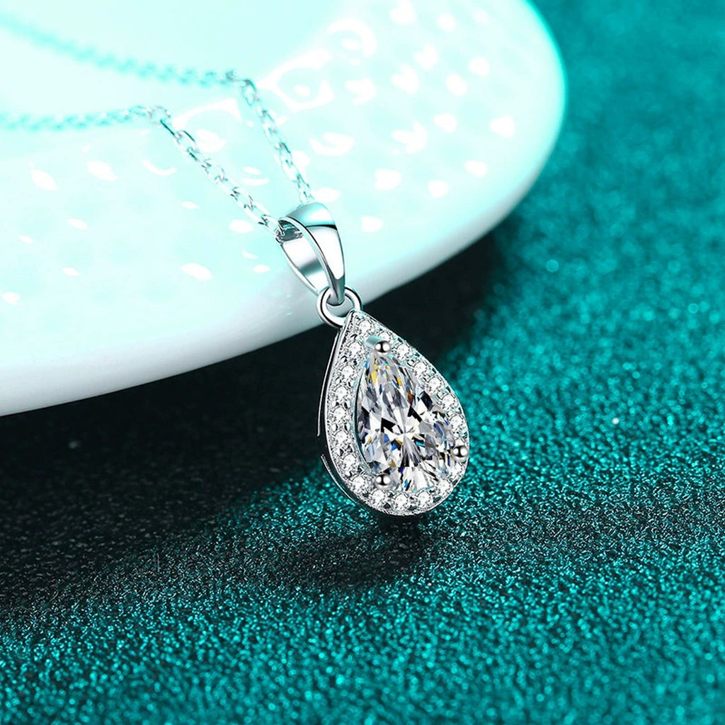 Pear Cut Halo Moissanite Pendant Necklace with CZ in Rhodium-Plated S925 sterling silver close-up product scene showing pendant setting