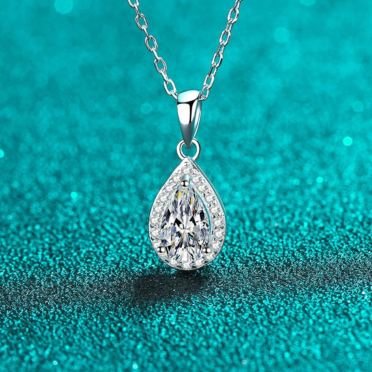 Pear Cut Halo Moissanite Pendant Necklace with CZ in Rhodium-Plated S925 sterling silver blue display scene showing chain and stone layout