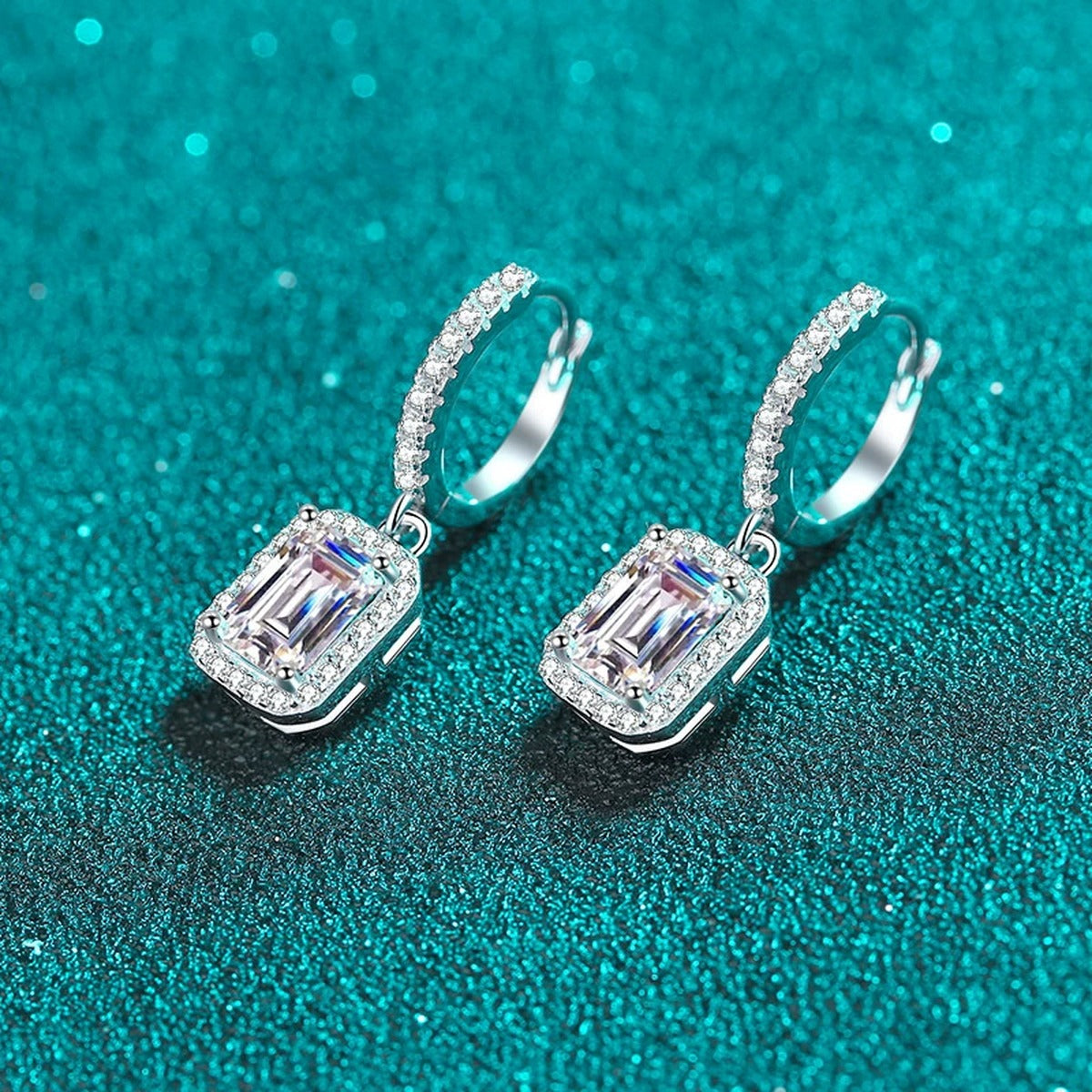Emerald and Radiant Moissanite Hoop Dangle Earrings with CZ in Rhodium-Plated S925 sterling silver product scene view showing angled setting detail, moissanite setting, and hoop dangle earrings design