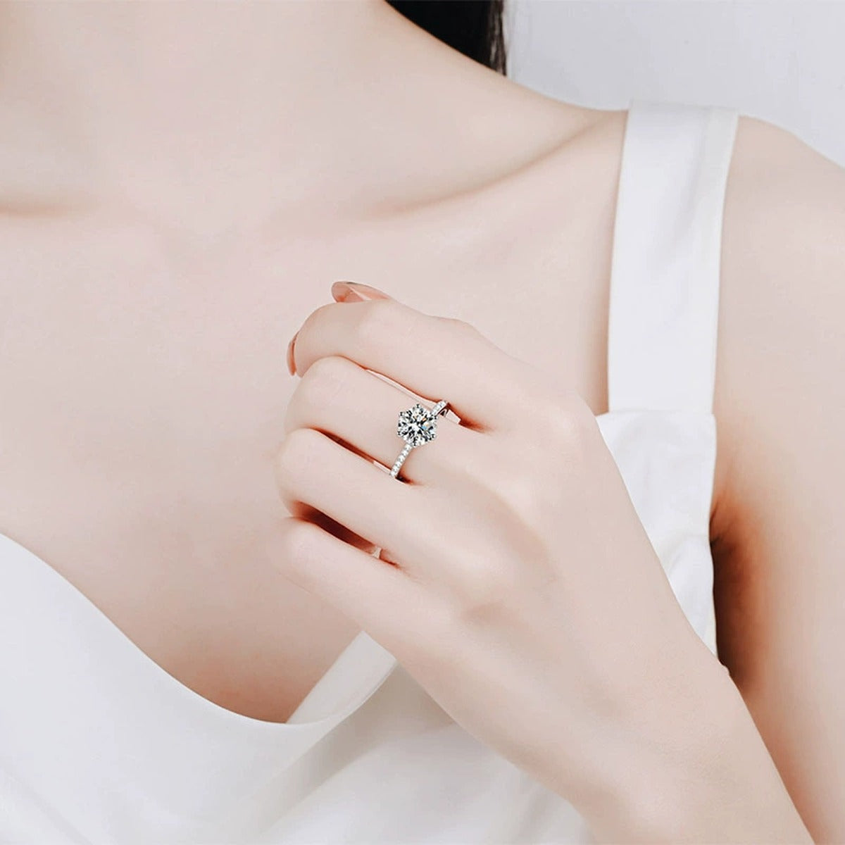 Round Moissanite Ring with CZ worn on hand to show scale and ring profile