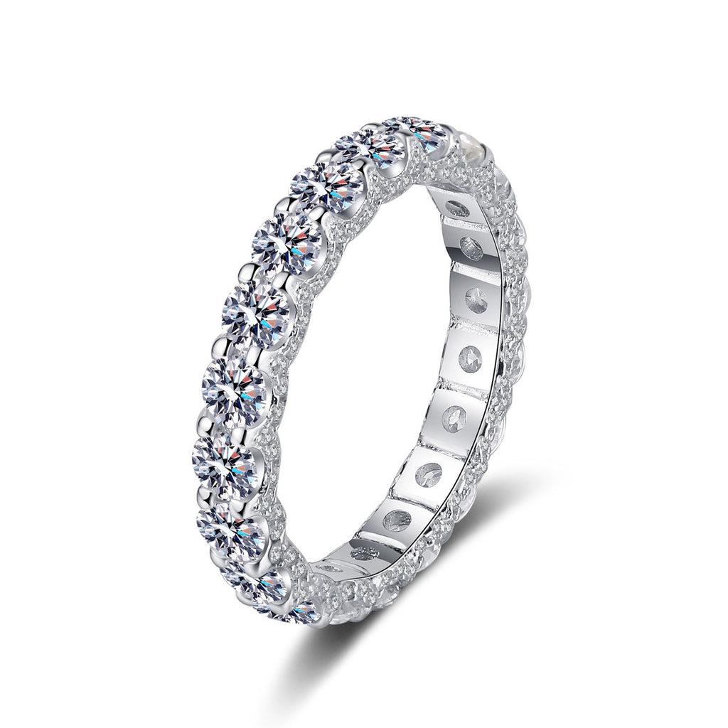 Round Moissanite Eternity Band Ring in rhodium-plated S925 sterling silver on clean white background
