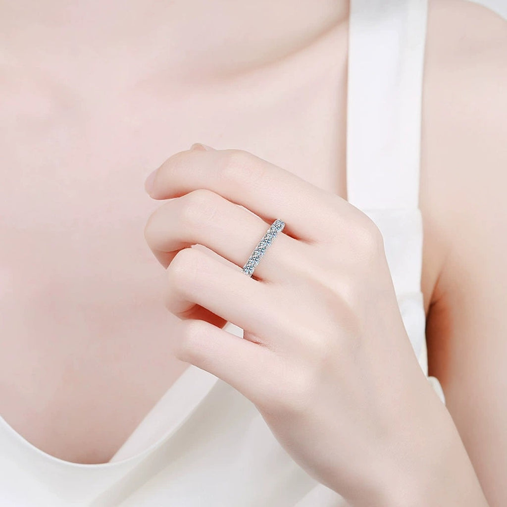 Round Moissanite Eternity Band Ring worn on hand to show scale and ring profile
