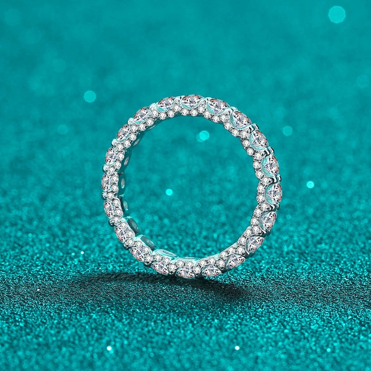 Round Moissanite Eternity Band Ring product view showing moissanite setting and rhodium finish