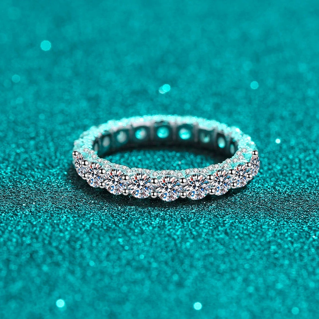 Round Moissanite Eternity Band Ring product view showing moissanite setting and rhodium finish