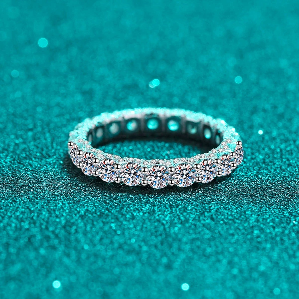 Round Moissanite Eternity Band Ring product view showing moissanite setting and rhodium finish