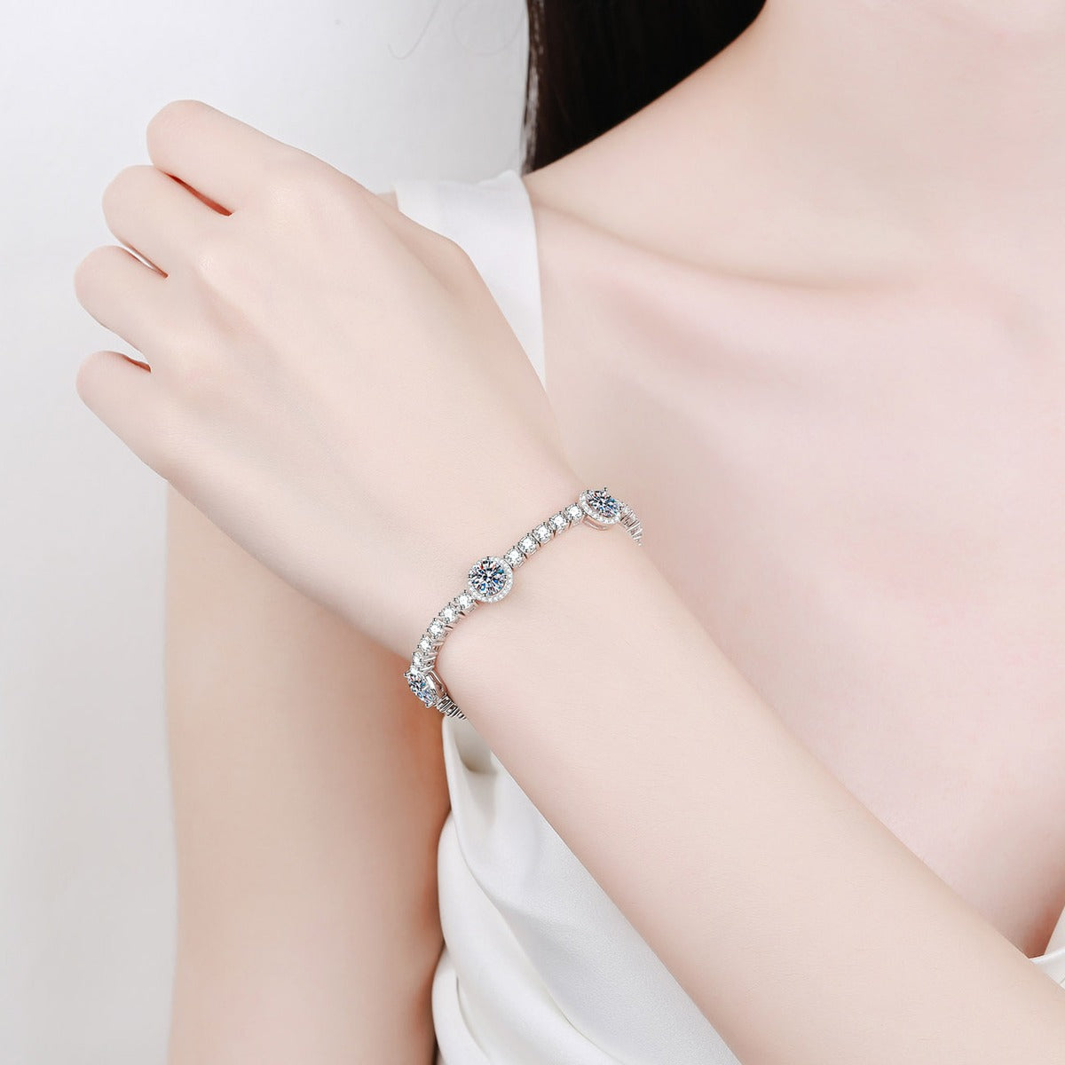 Halo Station Moissanite Bracelet in Rhodium-Plated S925 sterling silver worn on wrist model view showing scale and adjustable fit